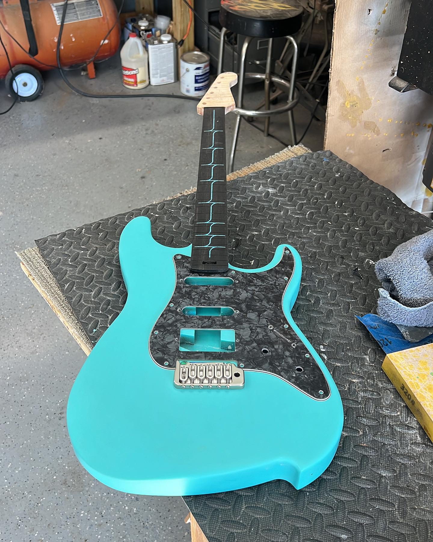 Teal S-style guitar