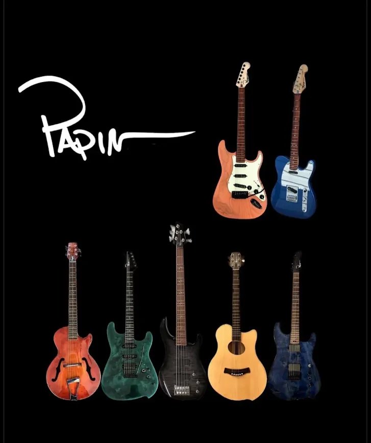Seven Papin guitars lined up: S-style, T-style, archtop, burl tops, a five-string bass and an acoustic